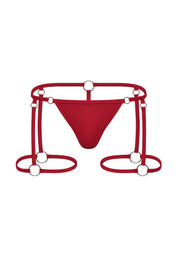 Red men's underwear harness with metal rings and strappy design, erotic lingerie style.