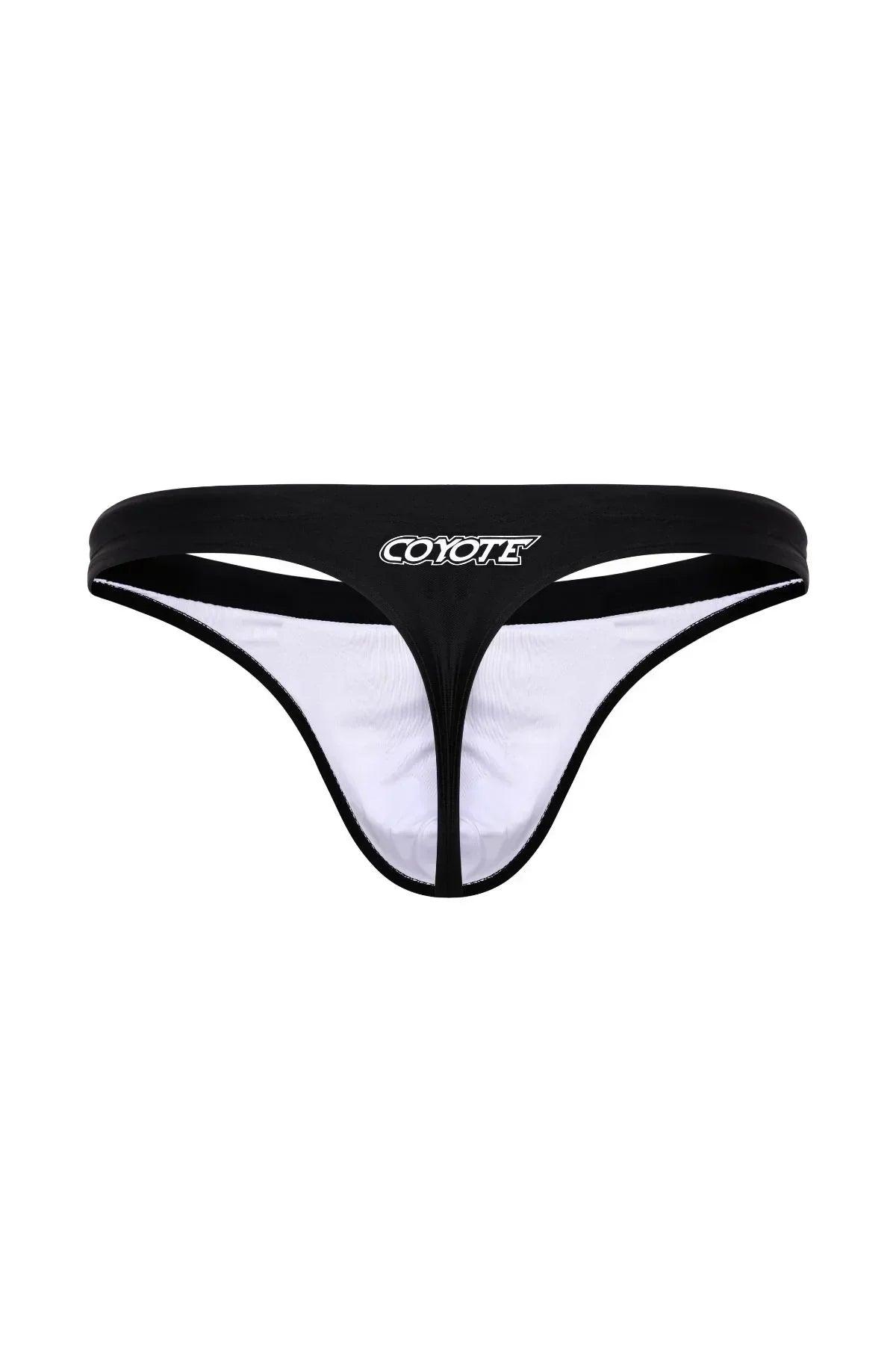 Black men's swim thong with white lining and bold COYOTE logo on waistband, front view