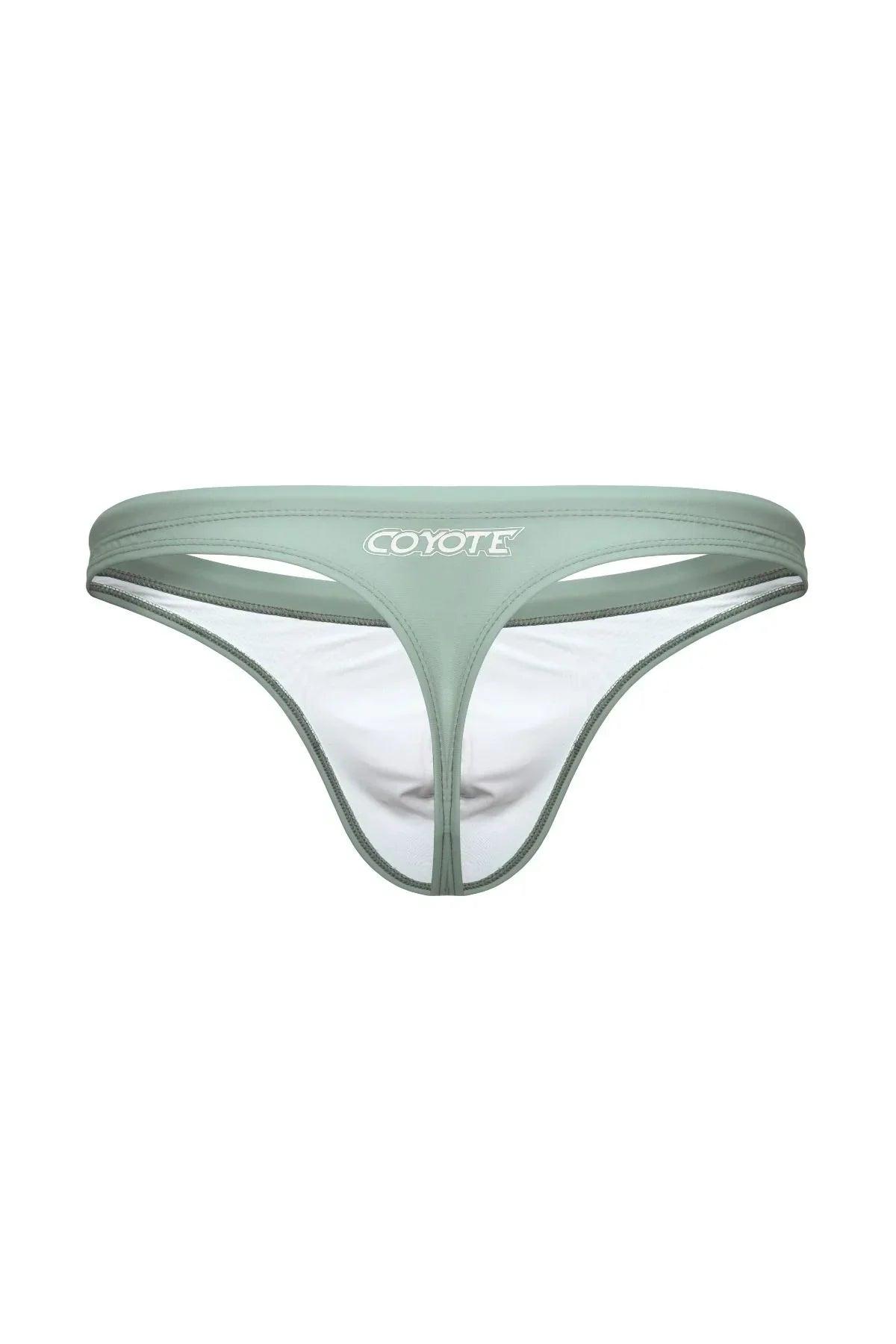 Sage green men's swim thong with cut-out front detail and white lining, isolated on white