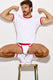 Man posing in white and red ringer t-shirt, jockstrap, and socks on a stool