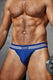 Athletic man in blue jockstrap underwear holding a dumbbell, showing toned body
