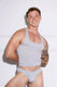 Man in gray athletic tank top and matching men's underwear, showcasing fit physique against white wall