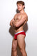 Athletic man in red briefs with white waistband posing against a plain white background