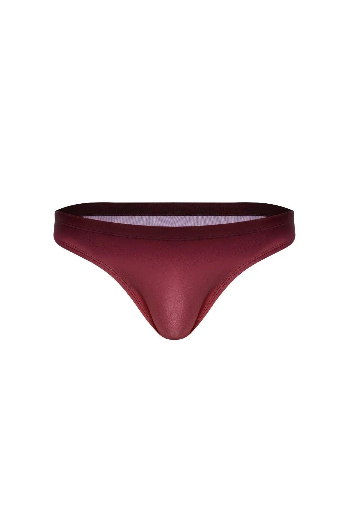 Bronze men’s swim brief with a sleek, low-rise fit and smooth, stretchy fabric on white background.