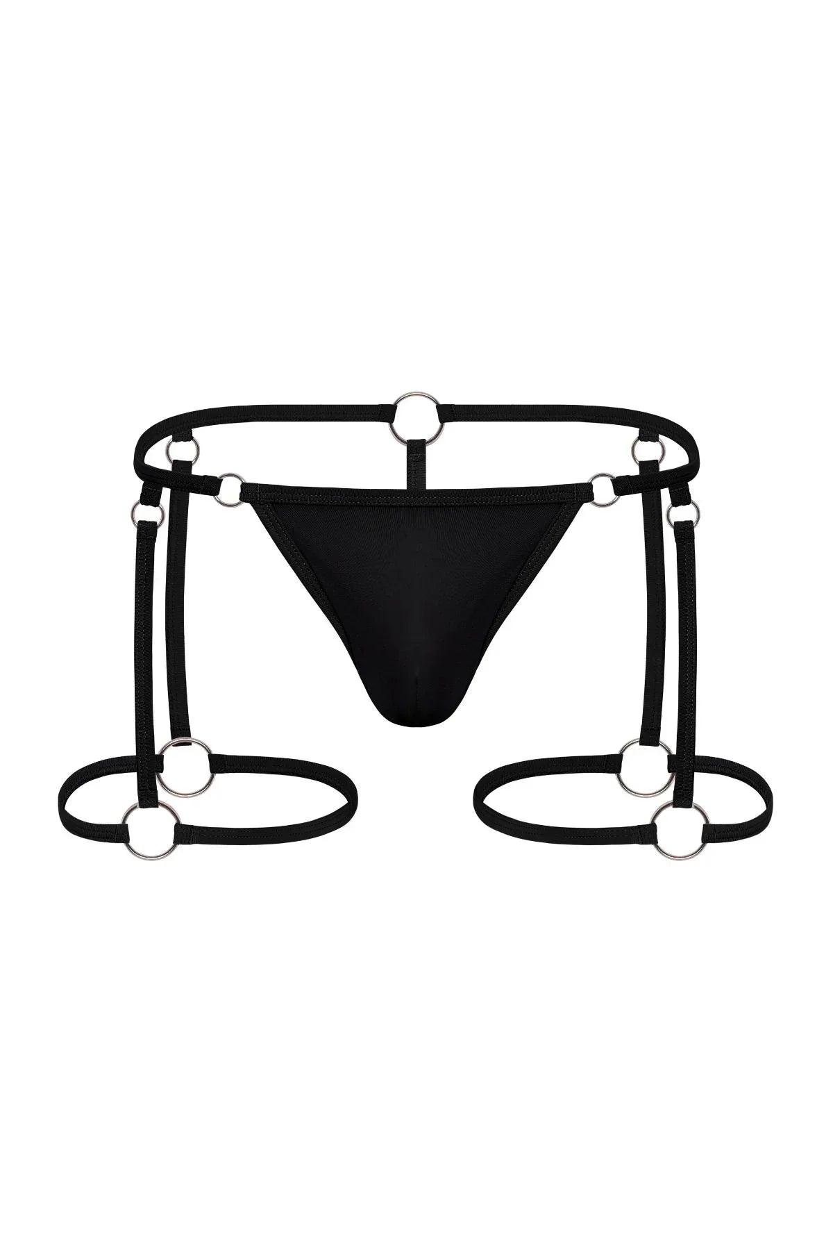 Jet black men's garter thong with metal ring hardware and strappy detailing on white background