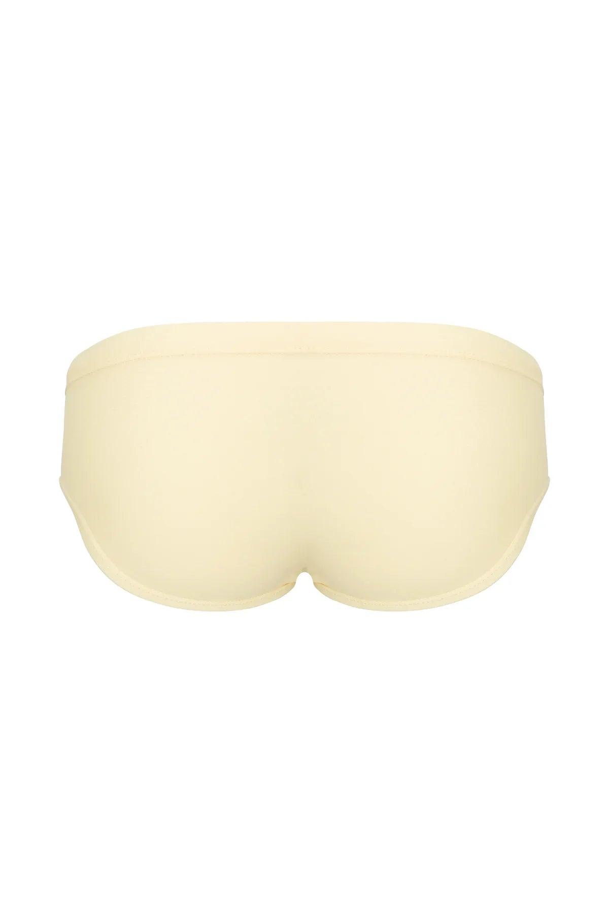 Cream men's low-rise briefs with seamless design, soft fabric, and contoured fit for comfort and style.