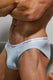 Close-up of a man wearing light blue men's briefs with white waistband detail